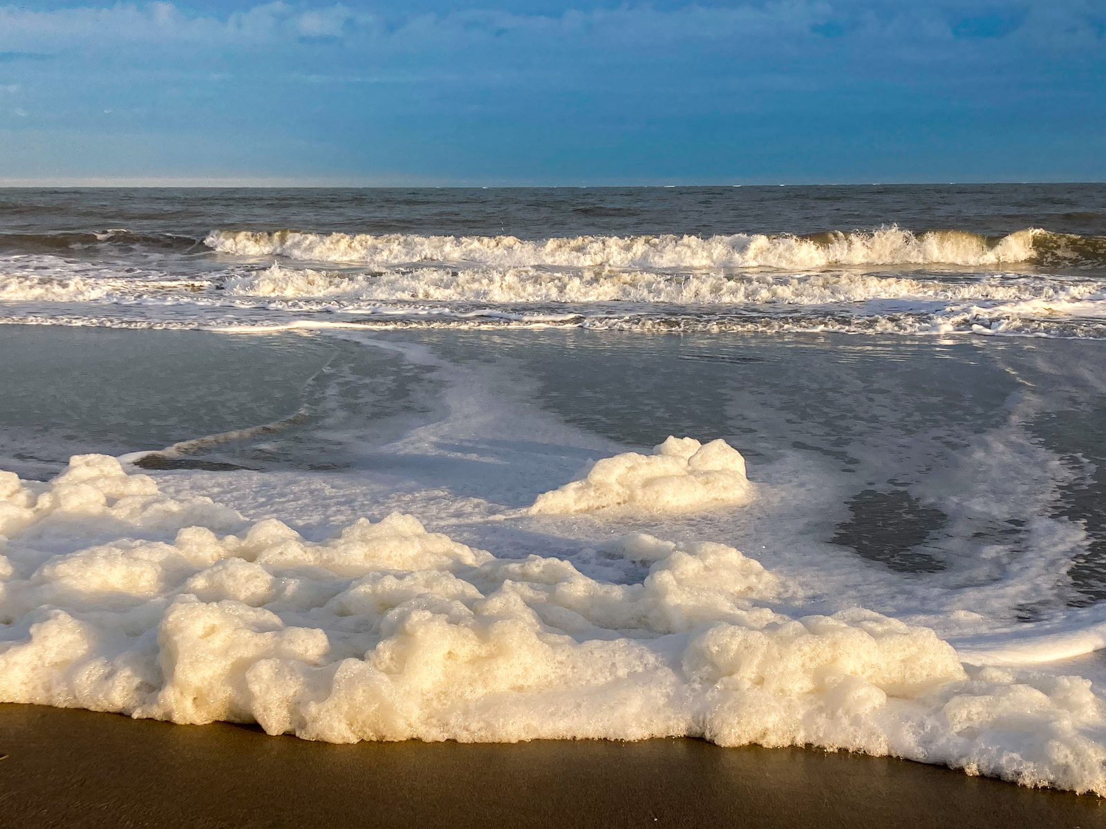 Sea foam rolling in