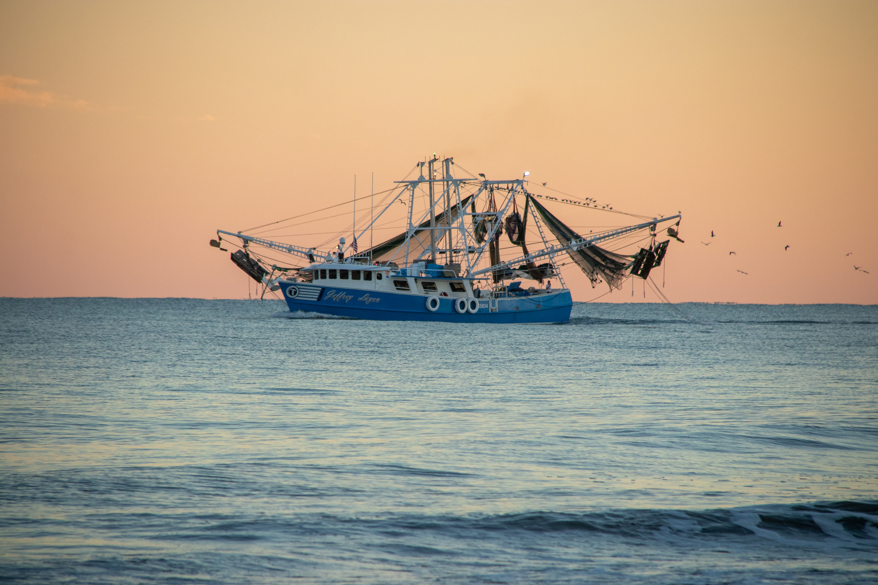 shrimp boat at sunset